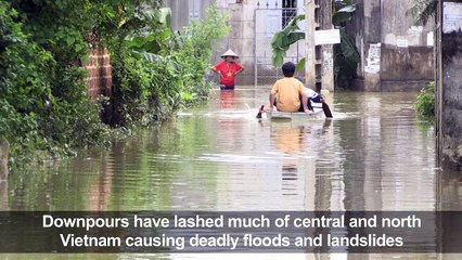 Vietnam braces for more downpours as flood toll rises