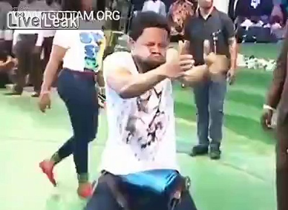 Christian pastor taking a deadly snake out from a man's body