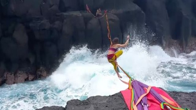 Daredevils Slackline Above Rocky Waters