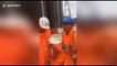 Construction workers pull colleague's tooth with string