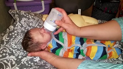 Silicone baby boy drinks (Magic Milk) bottle and wets diaper