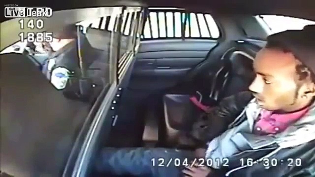 Suspect Pulls Gun on Police Officer from Back Seat in Police Car