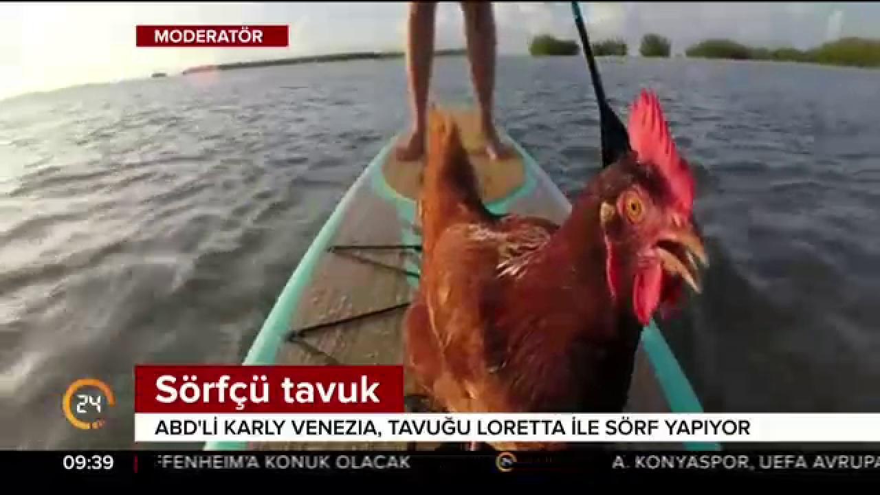 Sörf yapıyor