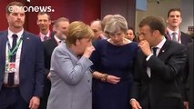 Macron, Merkel and May share hushed conversation in Brussels