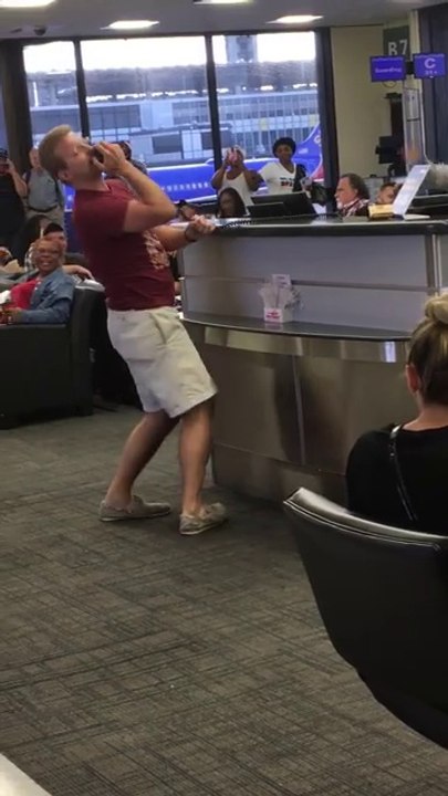 Traveler sings "No Diggity" in an airport