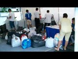 NET12 - Jasa cuci baju gratis bagi korban banjir