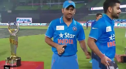 Dhoni pinching Kohli......