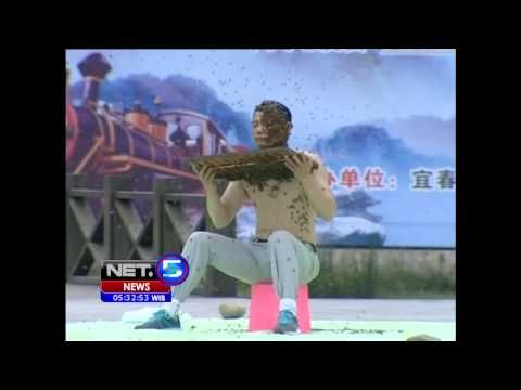 NET5 - Pemecah rekor manusia diselimuti lebah di Cina