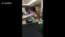 Kung fu master blows hole in bottom of glass bottle