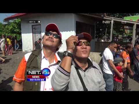 Ribuan Warga Saksikan Gerhana Matahari Sebagian di Perahu Wisata dan Pantai - NET24