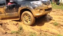 Toyota fortuner crawling through mud