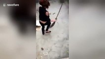 Hilarious footage of huge  rat chasing a woman around in circles