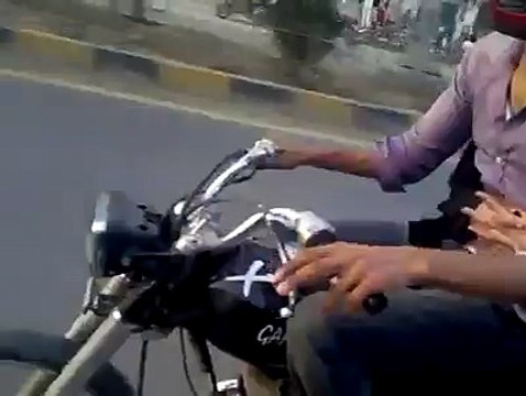 Boy wheeling on Bike with his Girl Friend