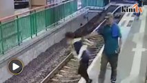 Man arrested in Hong Kong after pushing cleaner onto train track
