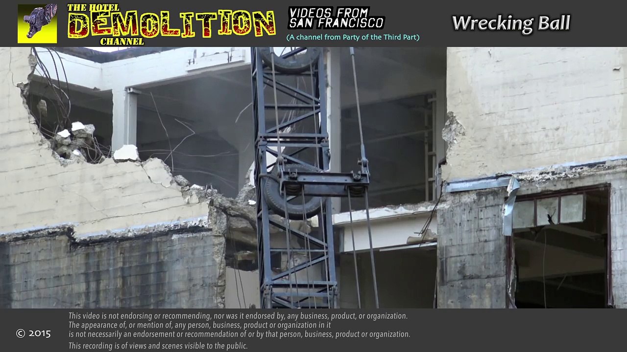 Wrecking ball in ion demolishing a concrete building