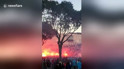 OM fans light up flares in front of Stade Velodrome in Marseille