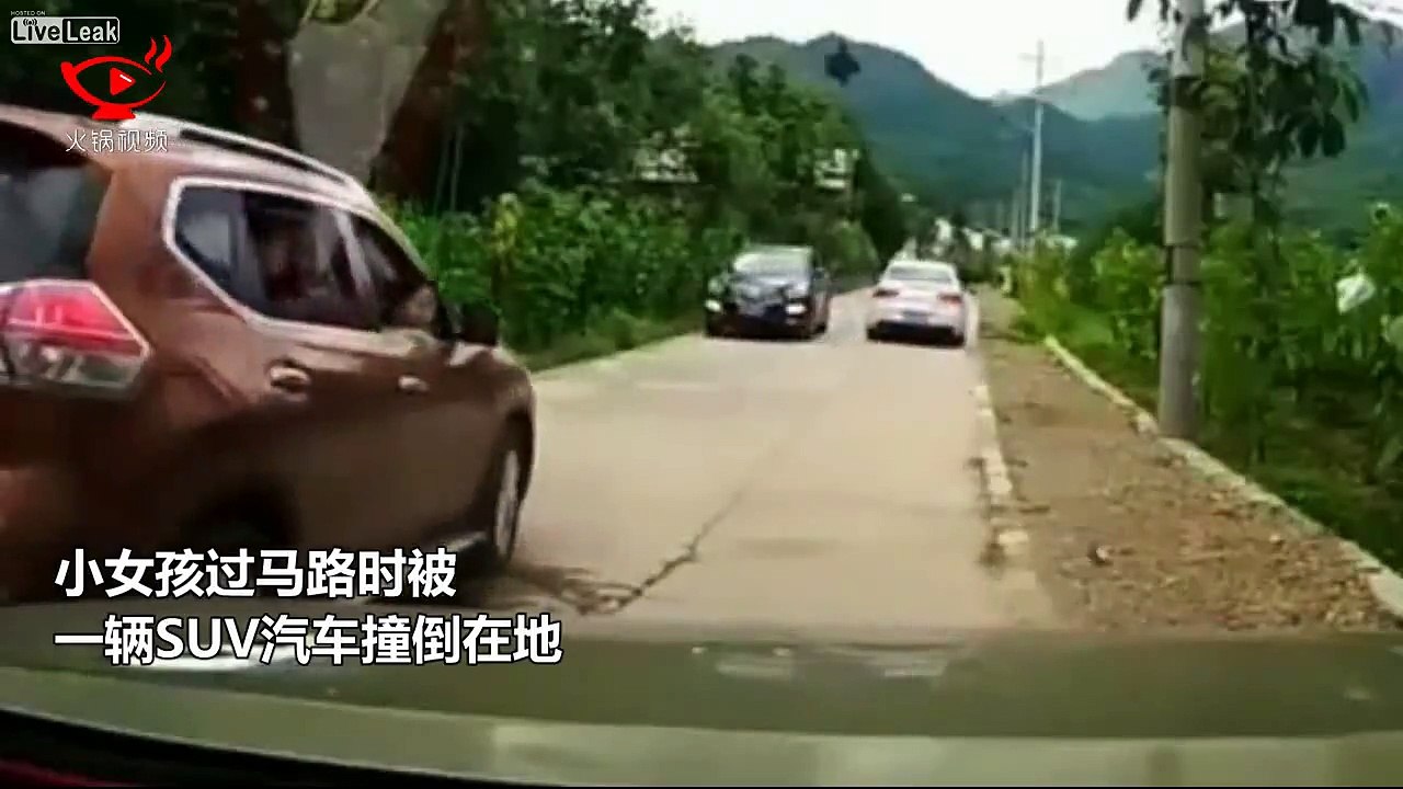 Little girl gets hit by an SUV when walking in front of a car.