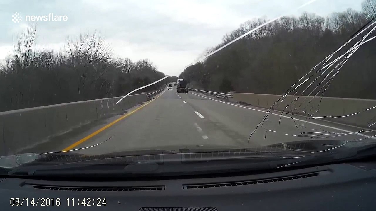 Flying metal sheet breaks car windscreen on Kentucky highway