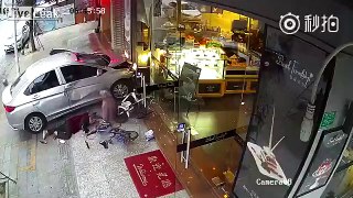 Car hits two grandmas against store