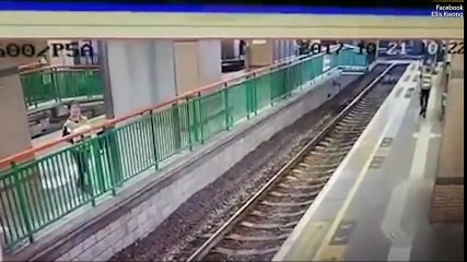 Sickening moment cleaner is shoved onto train tracks by commuter