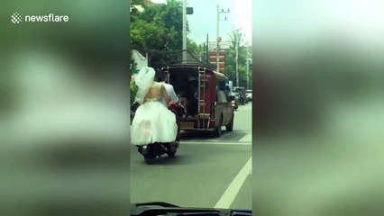 Bride riding pillion gets pulled over by police for not wearing helmet