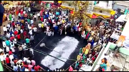 Woman rescued after tripping on hot coals during fire-walking ritual