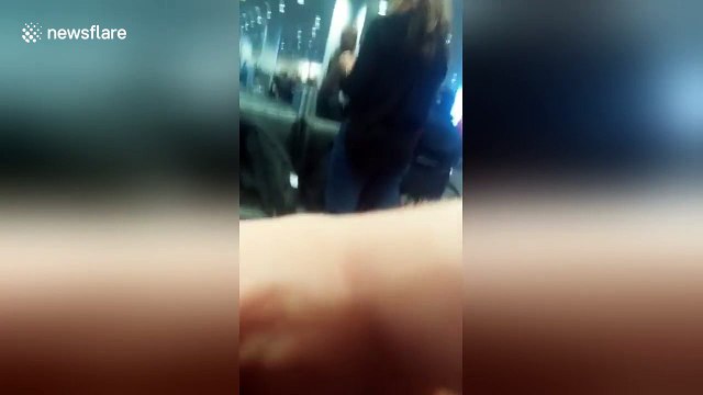 Woman escorted by police after rant over choosing her seat