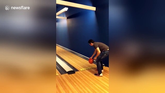 Man's fingers get stuck in bowling ball as he goes bowling for the first time
