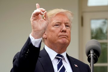 Trump says he's a 'victim' in Clinton-dossier case