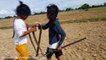Wow! Brave Sisters Catch Two Big Snakes While Digging Crabs in Their Farm