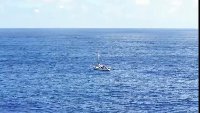 USS Ashland Rescues Two Sailors and Their Dogs Stranded At Sea