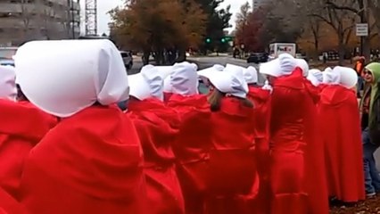 Mike Pence greeted by 'Handsmaids' in Denver