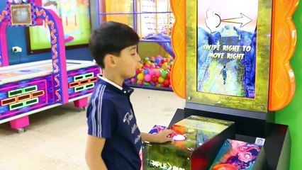 happy kids playing in an indoor playground witth funny games-eWCsd3cRFRU