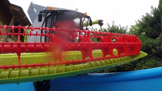 Bruder Toys Traktor and Combine falls into the water.