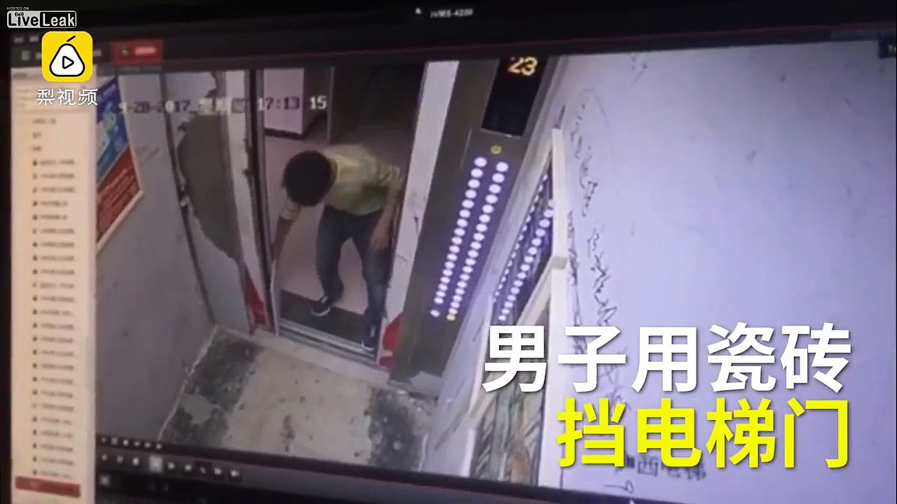 Chinese worker tries to stop elevator with a floor tile