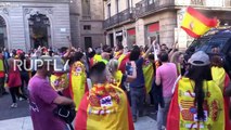 Spain: Police wield batons in scuffle, protester spits on TV crew
