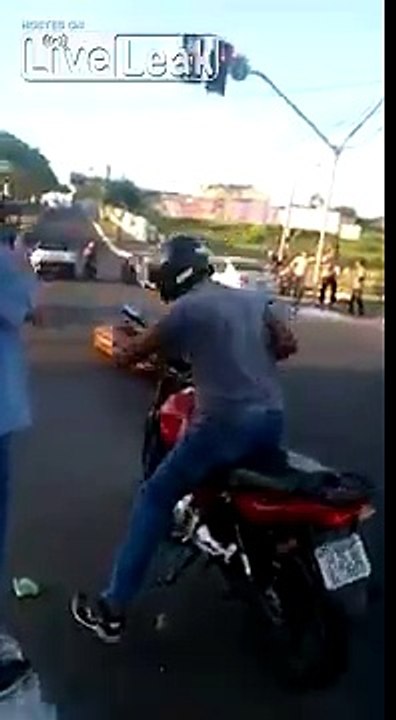 A coffin falls out of a hearse and sits on the streets