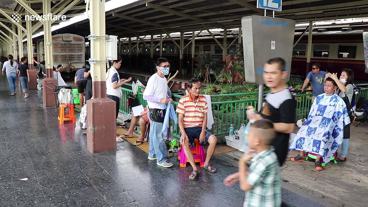 Hairdressers turn train station into salon offering free hair cuts to the poor