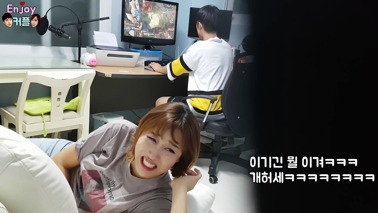 A girl turns off her boyfriend's monitor during a video game party
