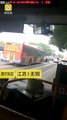 Chinese bus driver staring at his phone while driving