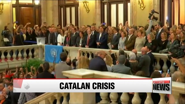 Deposed Catalan leader Carles Puigdemont flees to Brussels