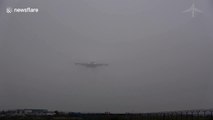 Plane appears from nowhere to land in thick Prague fog