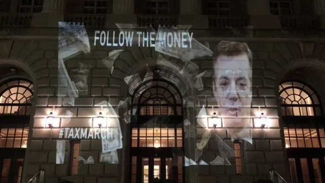 Tax Transparency Campaigners Project Paul Manafort's Face on IRS Building