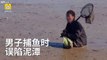 Fisherman stuck waist-deep in quagmire, unable to move