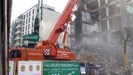 GIANT EXCAVATOR EATING LARGE BUILDING DEMOLITION CONSTRUCTION SITE