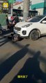 Chinese man lays under the car and begs to run over him