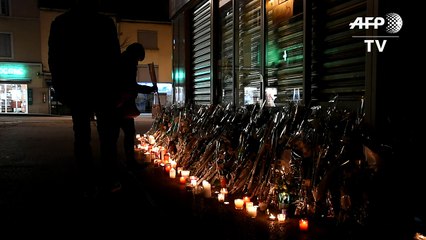 Fleurs et bougies en hommage à la joggeuse assassinée