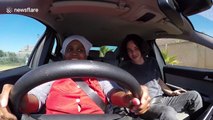 Woman freaks out as she gets behind the wheel for the first time