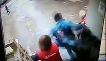 Criminal and police knocks down a worker off the loading dock. The criminal also gets a beating.