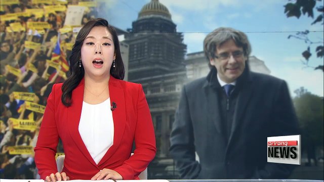 Ex-Catalan leader, officials surrender to Belgian police